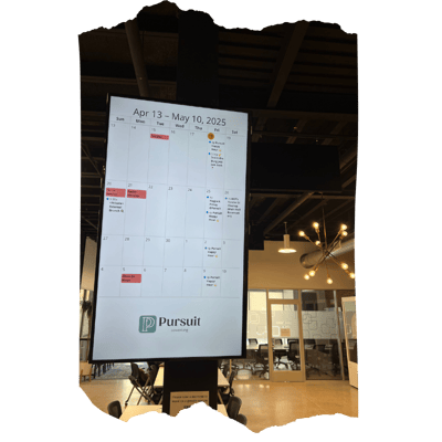 Digital sign at Pursuit Coworking