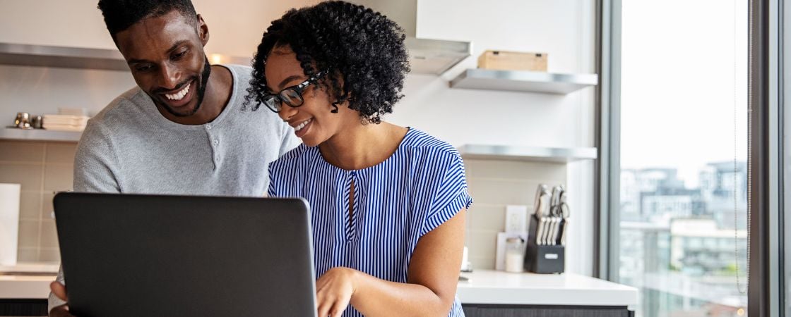 young african american professionals working on a laptop in a coworking space