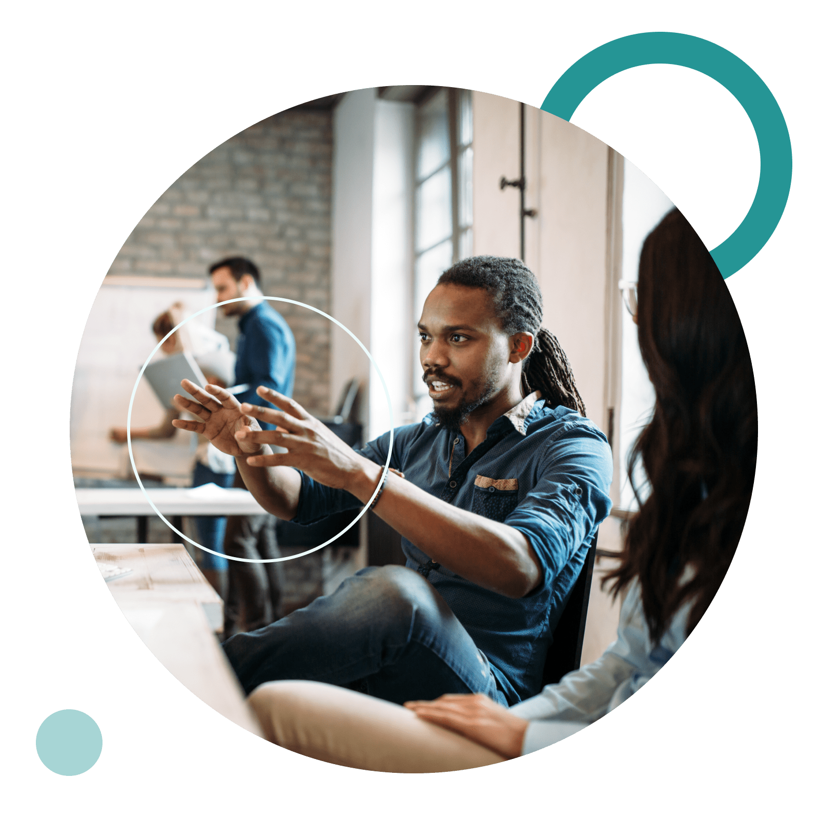 A man talks and gestures towards a screen in a coworking space